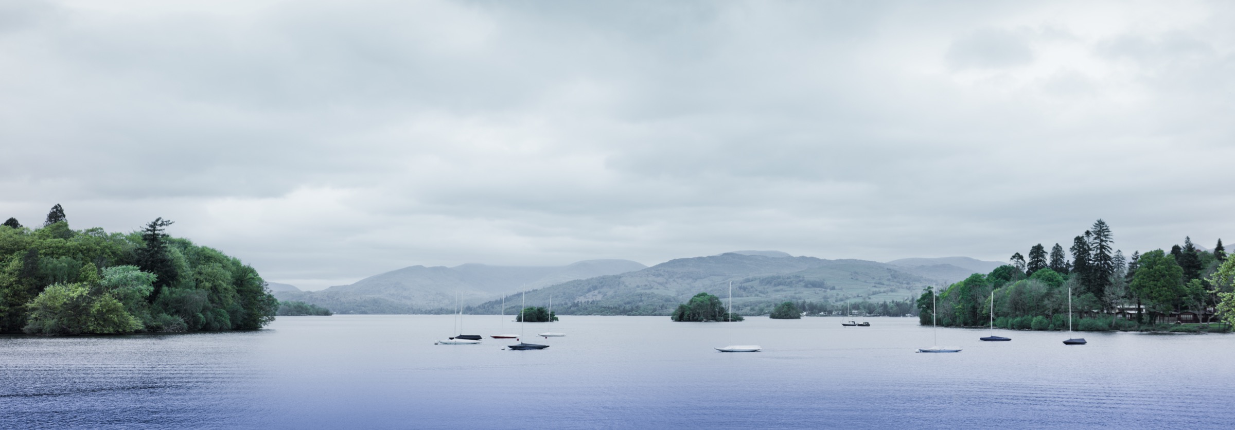 Sailing boats on Lake Windermere with the fells beyond
